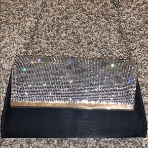 glittery and black over the shoulder mini purse!